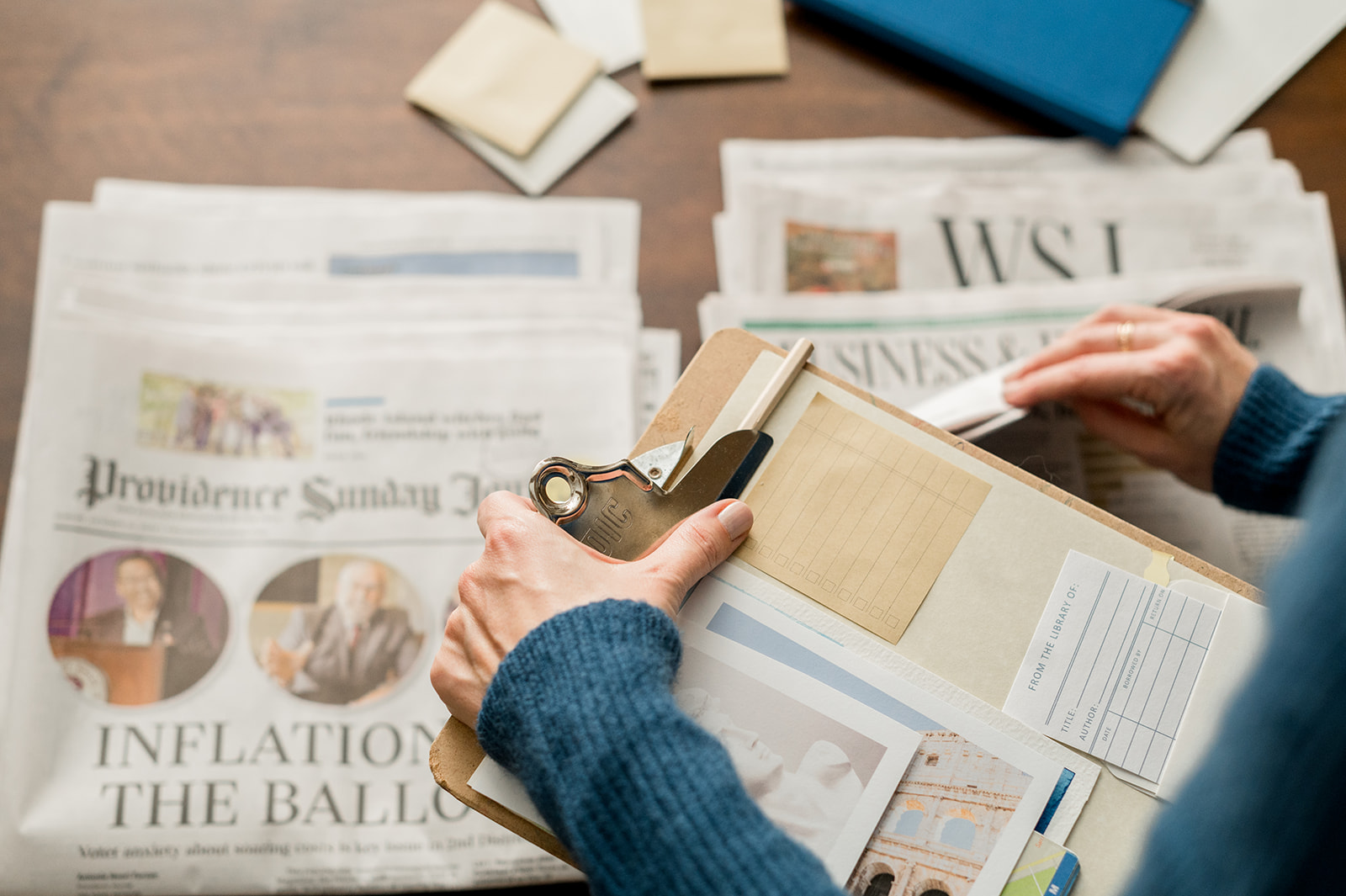 Website copywriter Courtney Fanning reviewing content with a clipboard in hand, representing the research and strategy behind professional web copywriting.